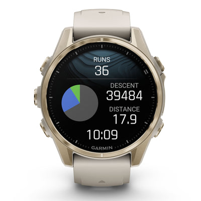 Garmin Fenix 8 Sapphire - 43 mm / AMOLED - Soft Gold avec bracelet en silicone gris brouillard/grès foncé - Montre multisport premium
