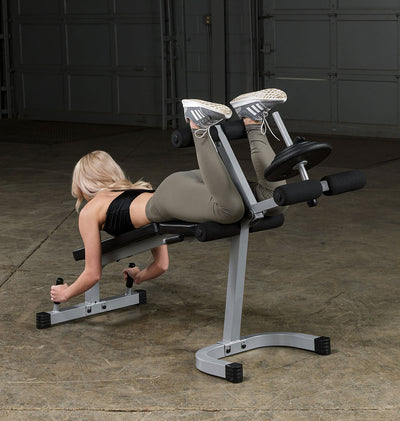 Banc d'exercices pour flexions et extensions de jambes - Body-Solid Powerline PLCE165X - Chargement sur plaques